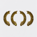 Four bonded rear drum brake shoes with metal webs and dark friction lining