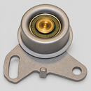 One main timing belt tensioner pulley with slotted mounting bracket