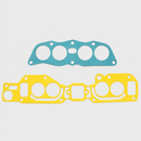 Two-piece intake gasket set with one blue upper gasket and one yellow lower gasket