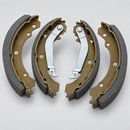 Complete rear drum brake shoe set angled view